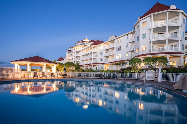 Seasonal outdoor pool, open 8:00 AM to 11:00 PM, pool umbrellas