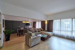 Club Suite, 1 Bedroom, City View | Living area | 27-inch LCD TV with satellite channels, TV, iPod dock