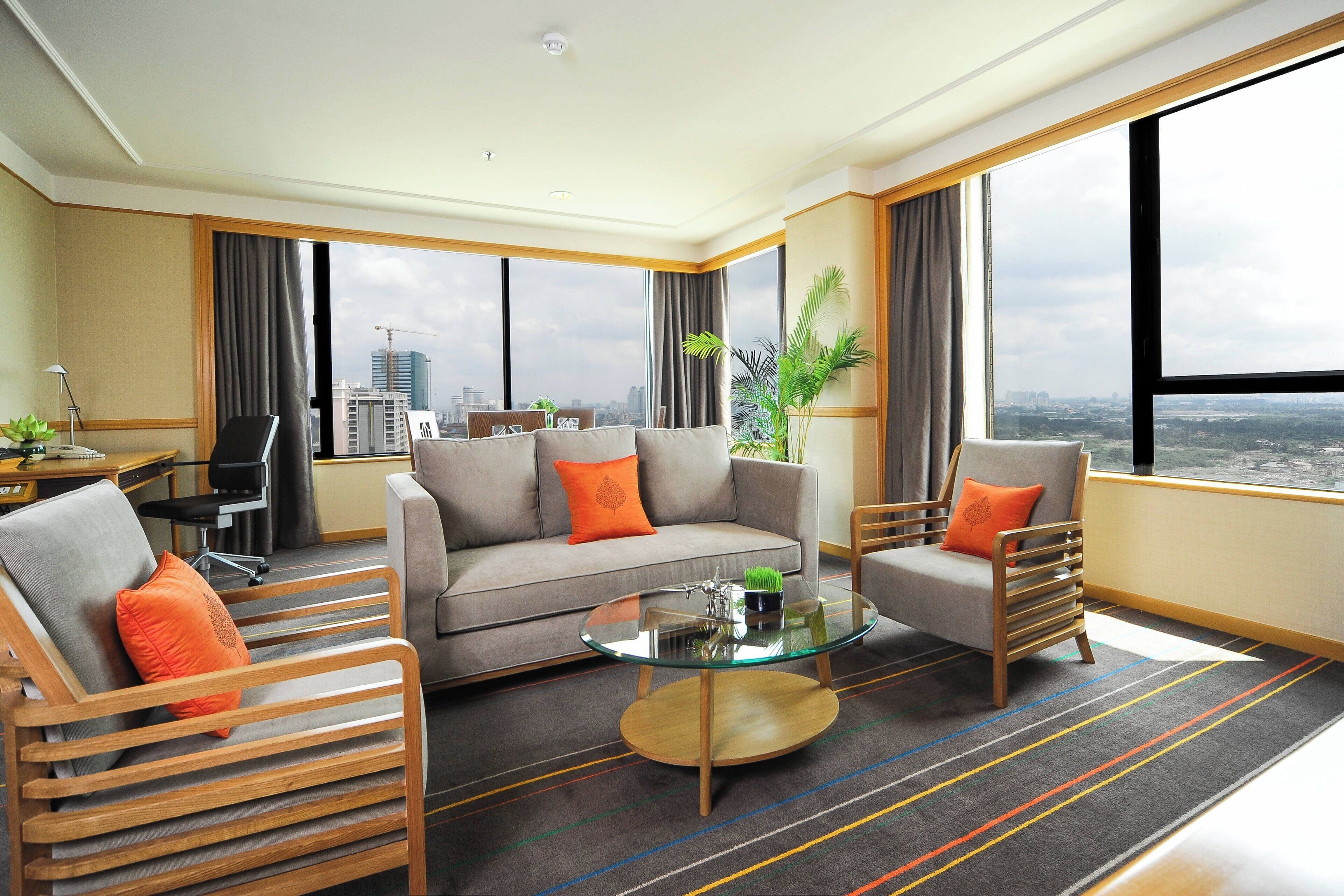 deluxe suite, 1 king bed, non smoking, river view | living area | 49-inch lcd tv with cable channels, tv