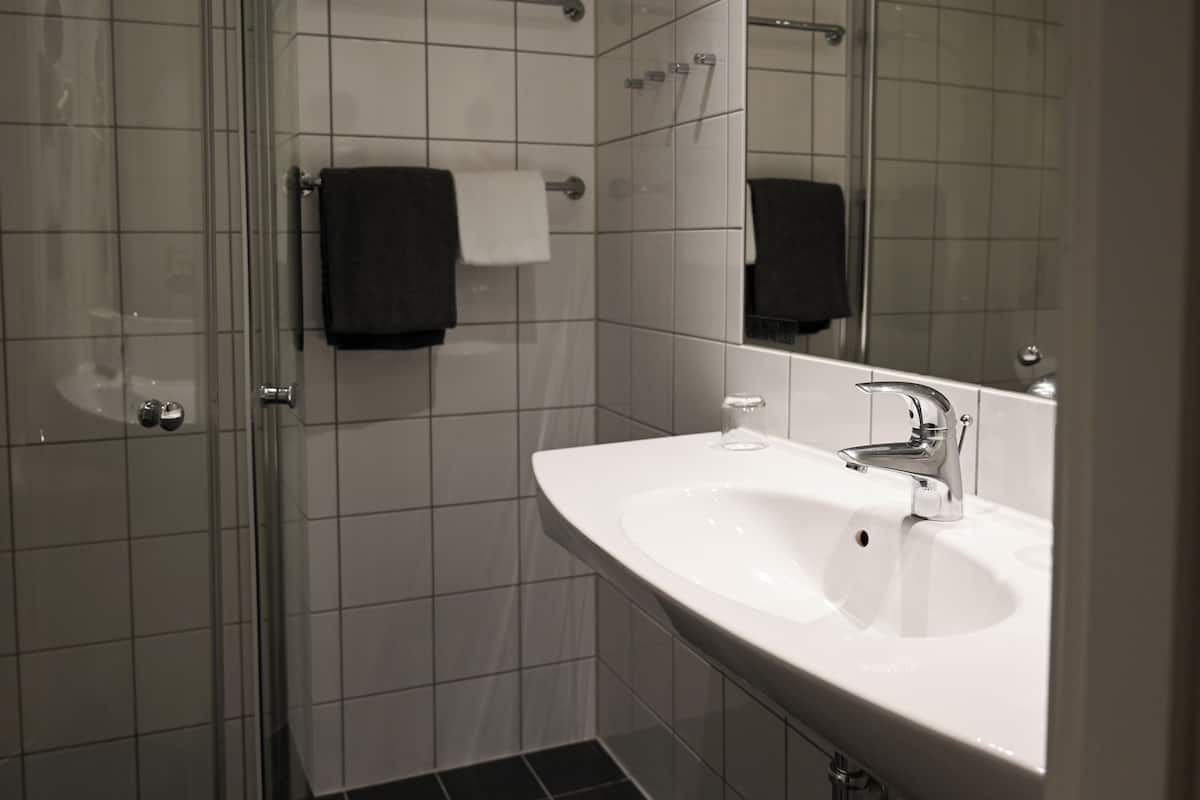 superior single room, non smoking | bathroom | hair dryer, towels