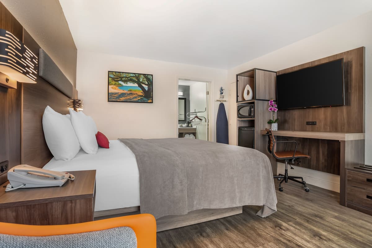 Premium bedding, desk, laptop workspace, iron/ironing board