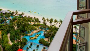 A resort with a pool, beach, and ocean view. - Dusit Beach Resort Guam (Tamuning)