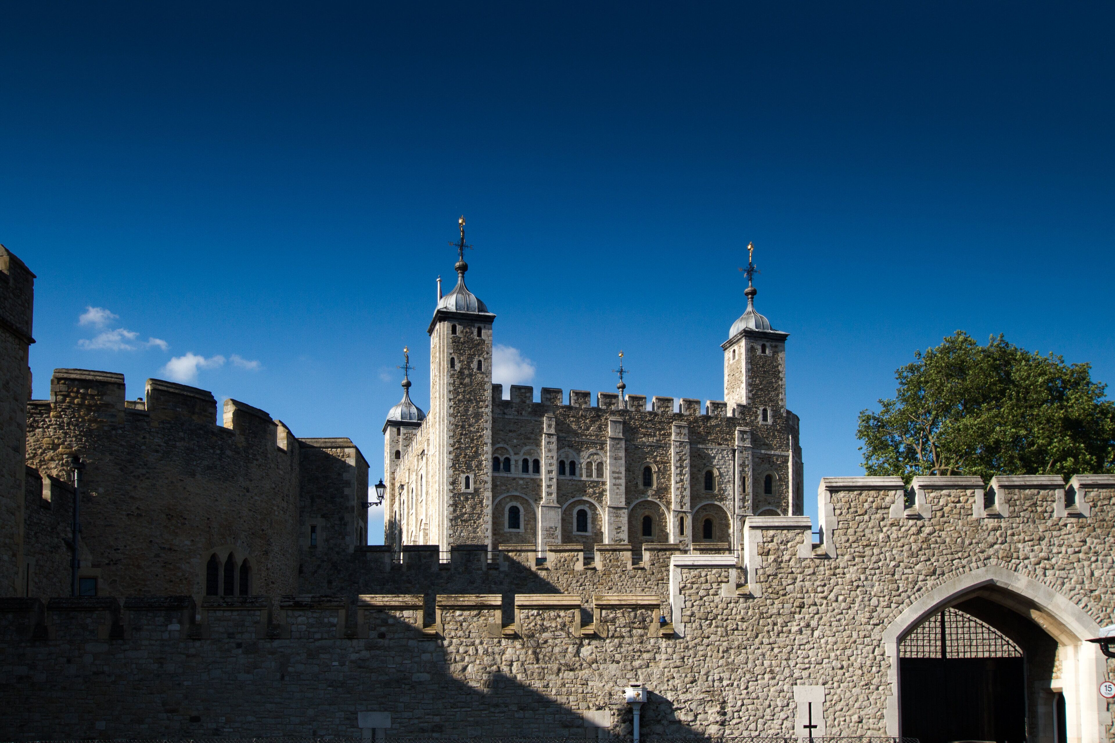 A historic stone castle with multiple towers and a fortified wall.