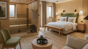 A modern hotel room with a bed, seating area, and a view of the outdoors. - Hotel Sommer Füssen (Fuessen)