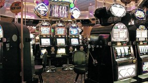A casino with multiple slot machines and a neon sign that reads "Party Time!". - Gold Dust West Carson City (Carson City)