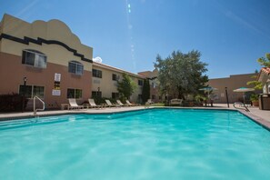 Seasonal outdoor pool, open 9:00 AM to 10:00 PM, pool umbrellas