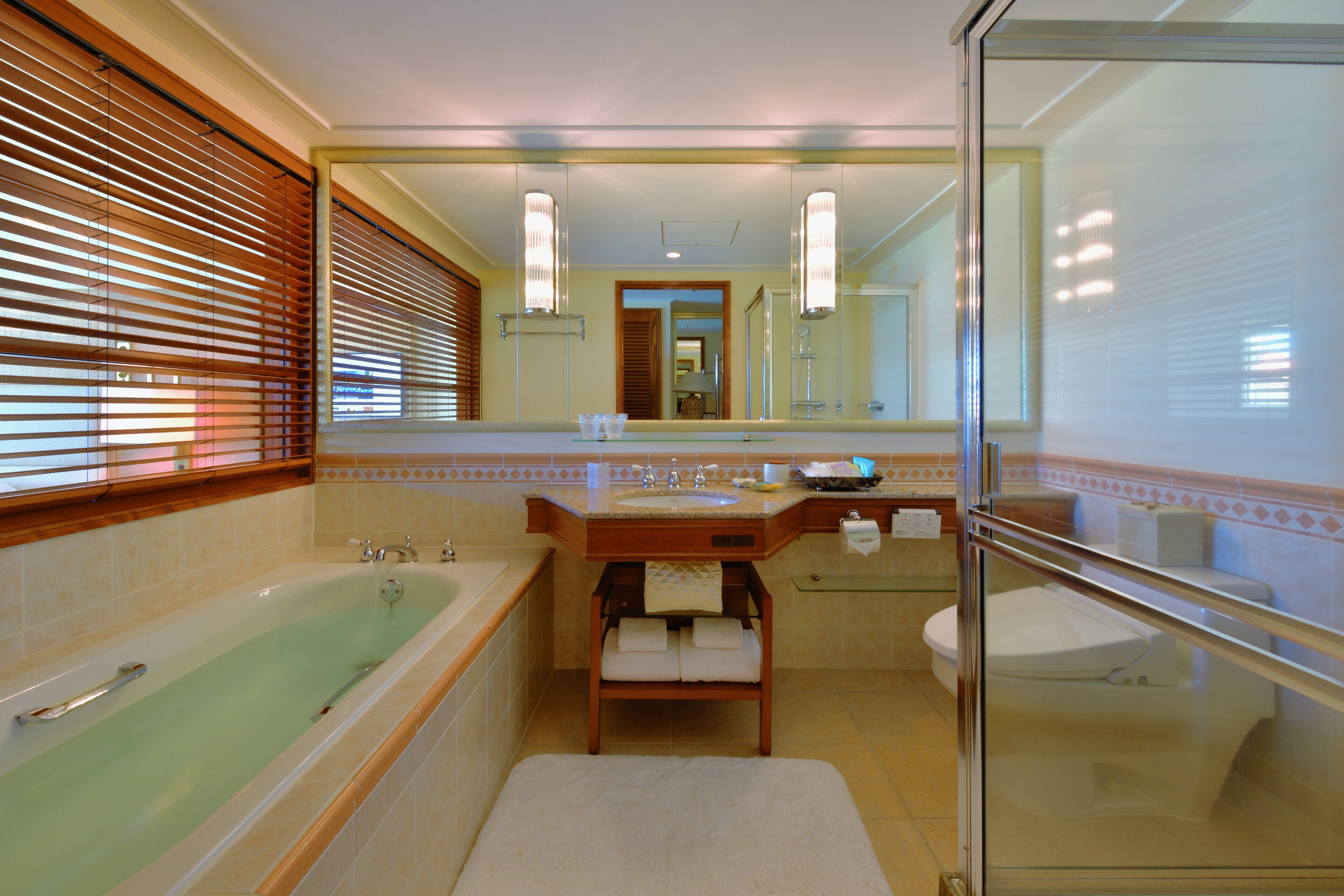 separate bathtub and shower, designer toiletries, hair dryer, slippers