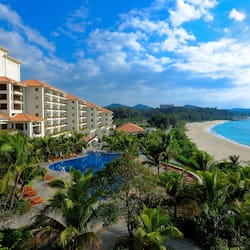 On the beach, white sand, sun loungers, beach umbrellas