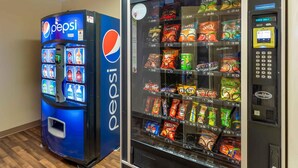 A vending machine with Pepsi and a snack vending machine with various snacks. - Extended Stay America Suites Denver Aurora North (Aurora)