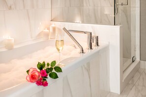 Designer toiletries, hair dryer, bathrobes, slippers
