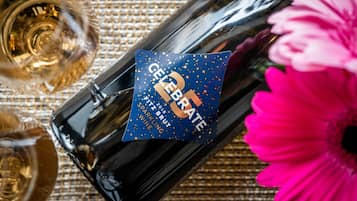 A bottle of sparkling wine with a label that reads "CELEBRATE 2018 BRUT SPARKLING WINE."