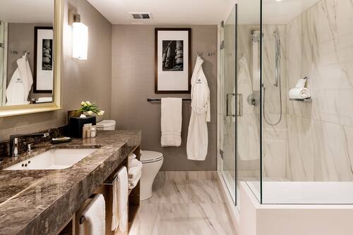 Designer toiletries, hair dryer, bathrobes, slippers