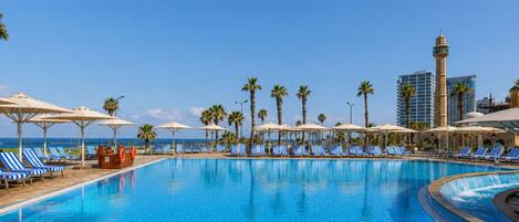 Outdoor pool, pool umbrellas, sun loungers