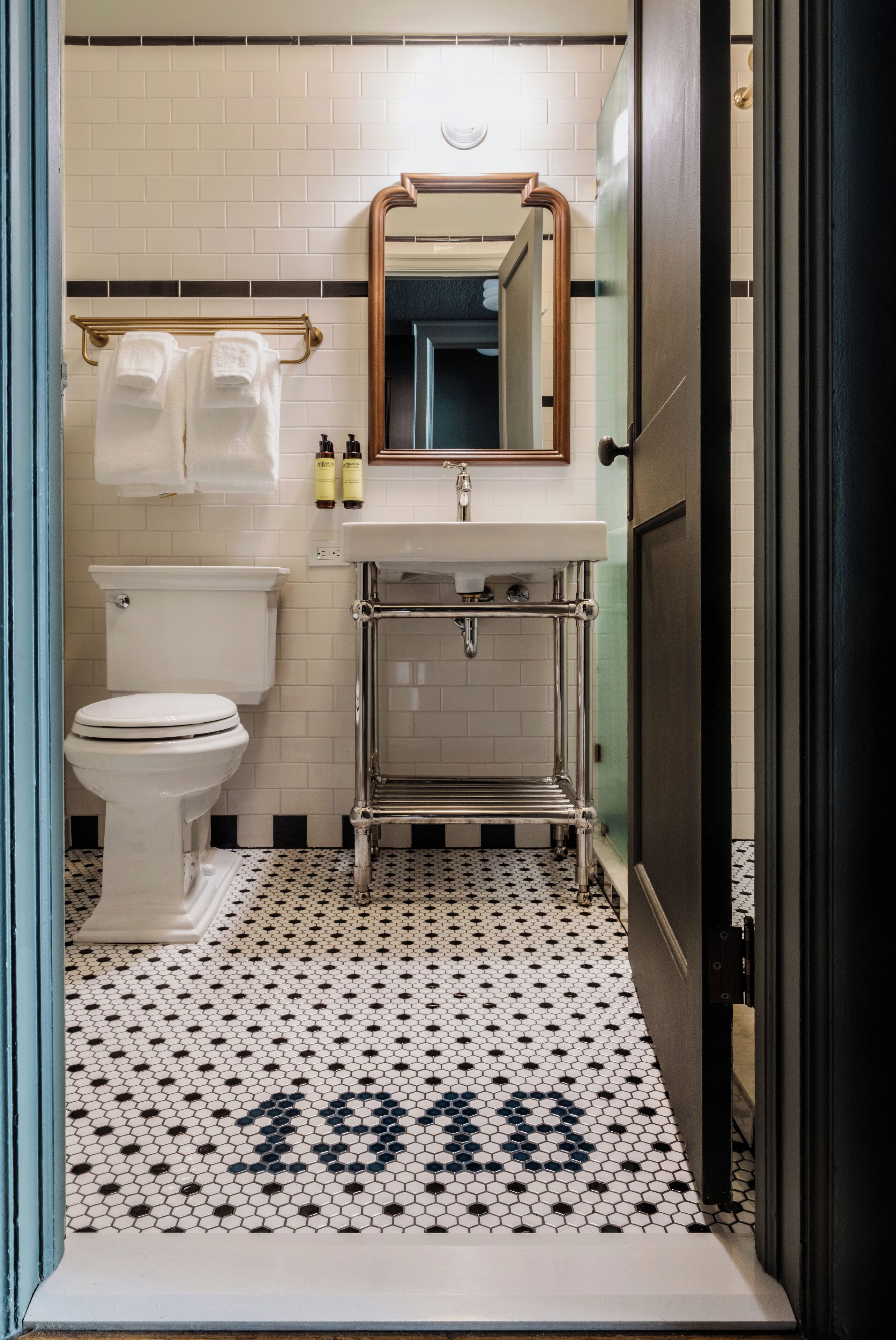 combined shower/bathtub, designer toiletries, hair dryer, bathrobes