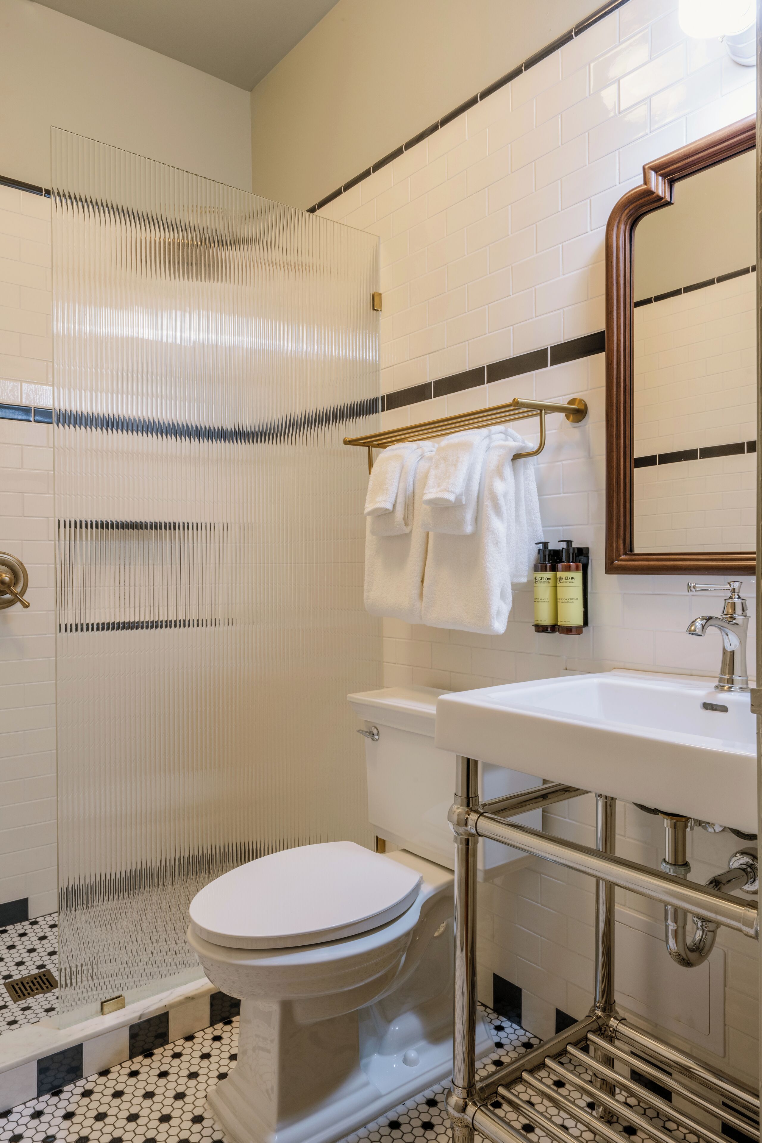 combined shower/bathtub, designer toiletries, hair dryer, bathrobes