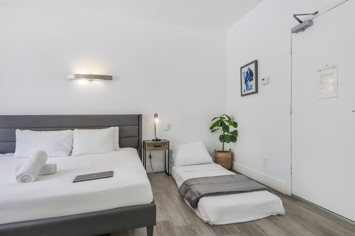 Standard Room, Multiple Beds, Private Bathroom (Self check-in) | In-room safe, desk, laptop workspace, blackout drapes