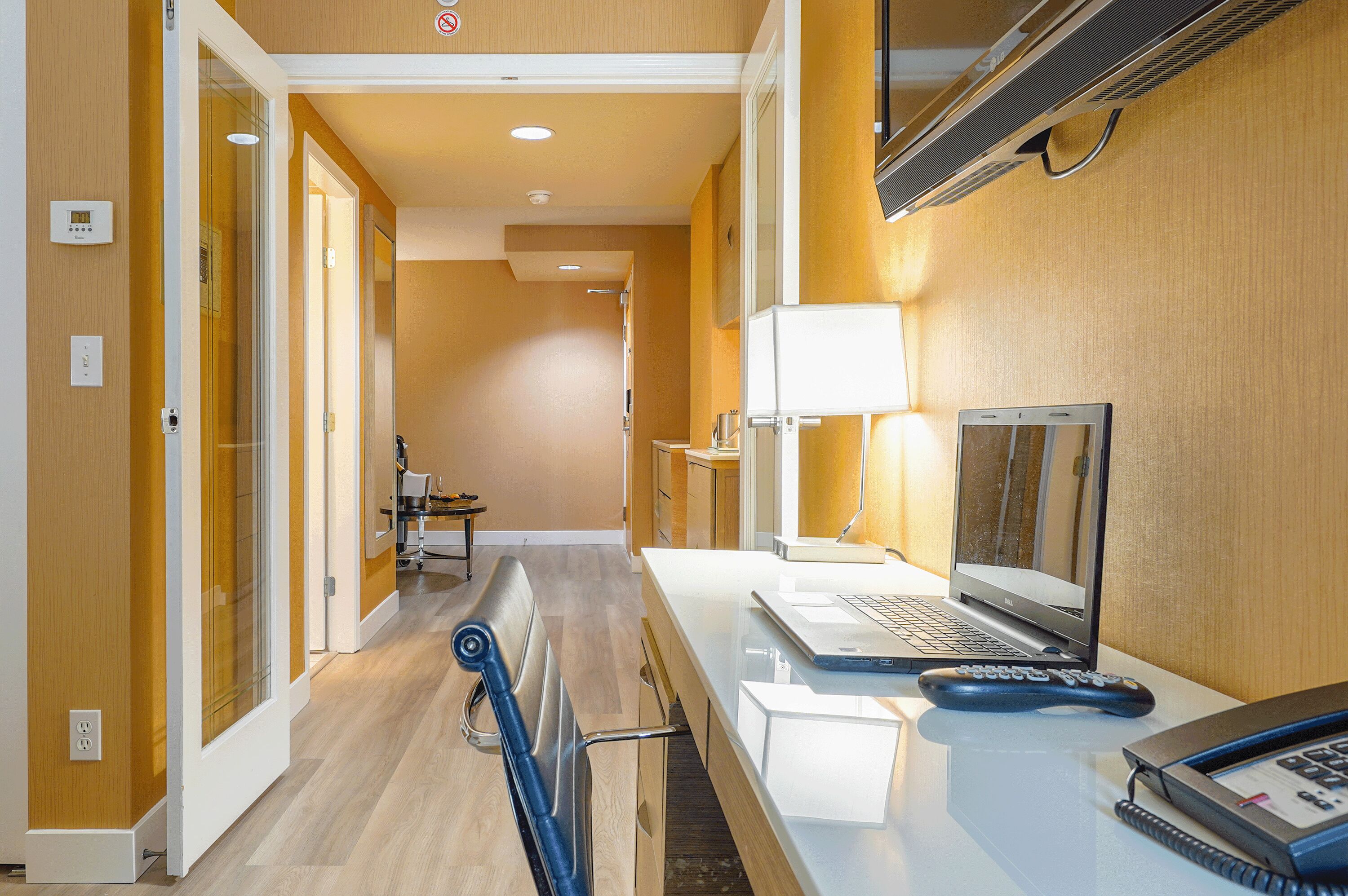 one bedroom queen suite | premium bedding, in-room safe, desk, laptop workspace