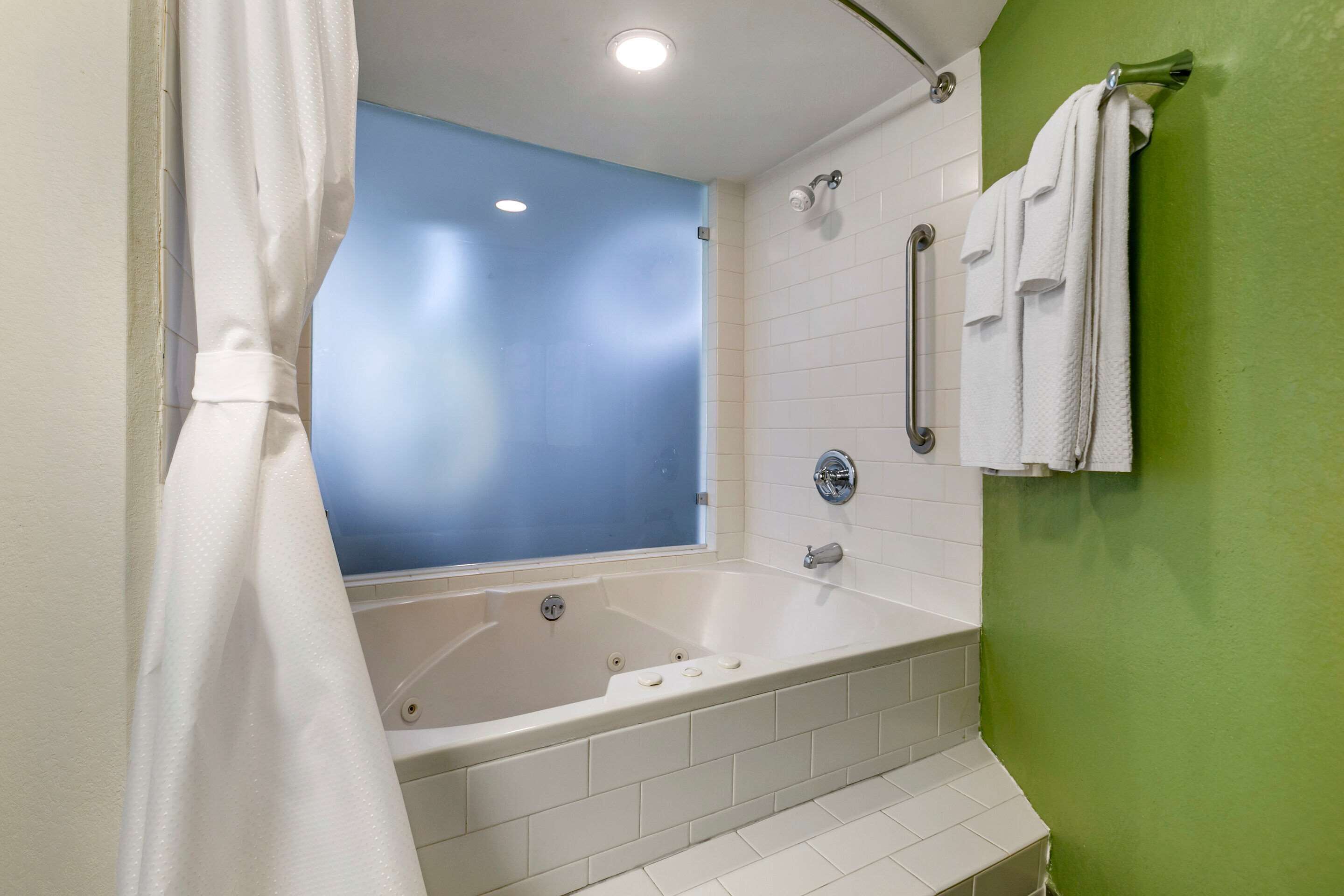 desk, laptop workspace, iron/ironing board, rollaway beds