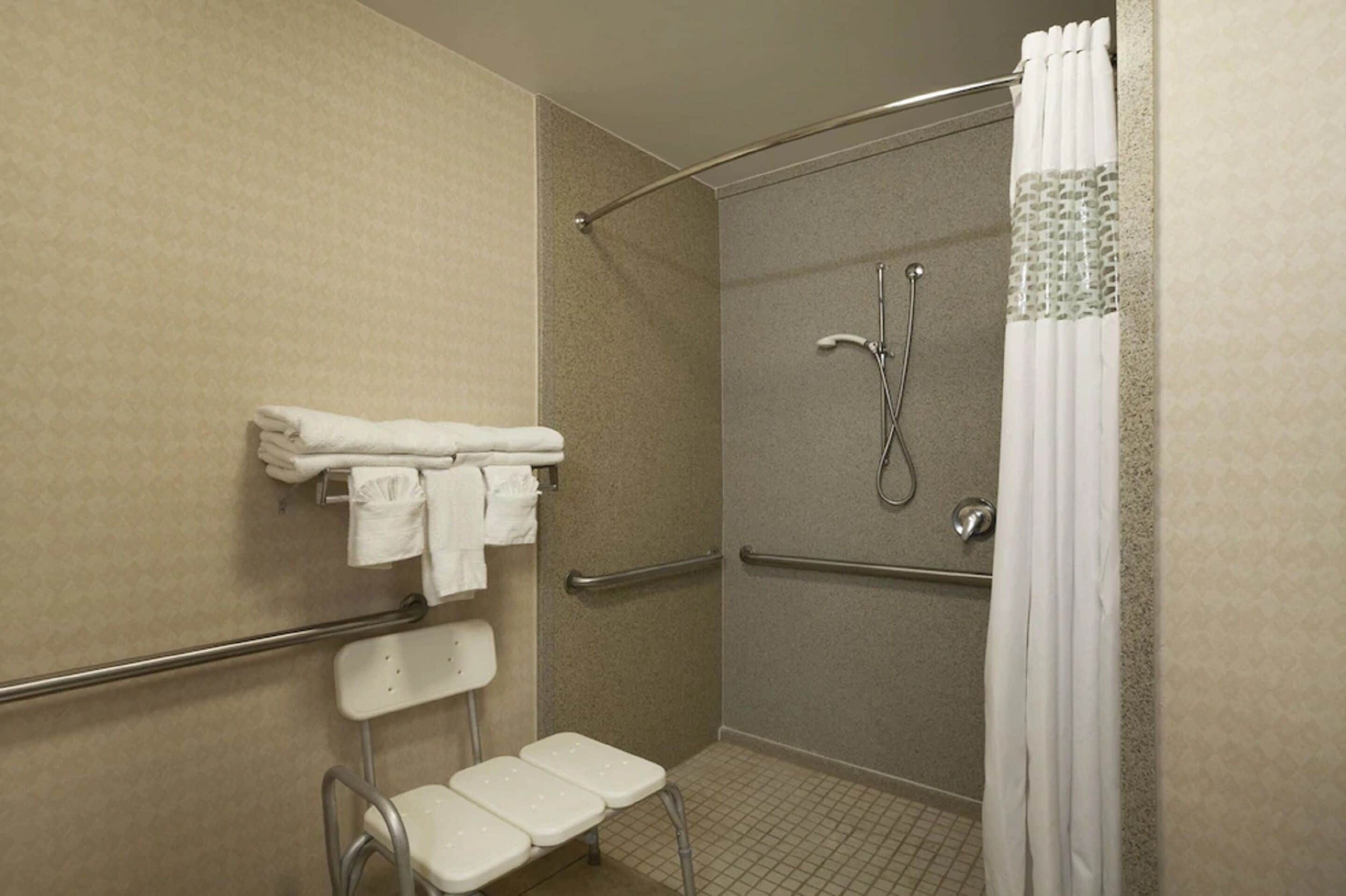 bathtub, hair dryer, towels