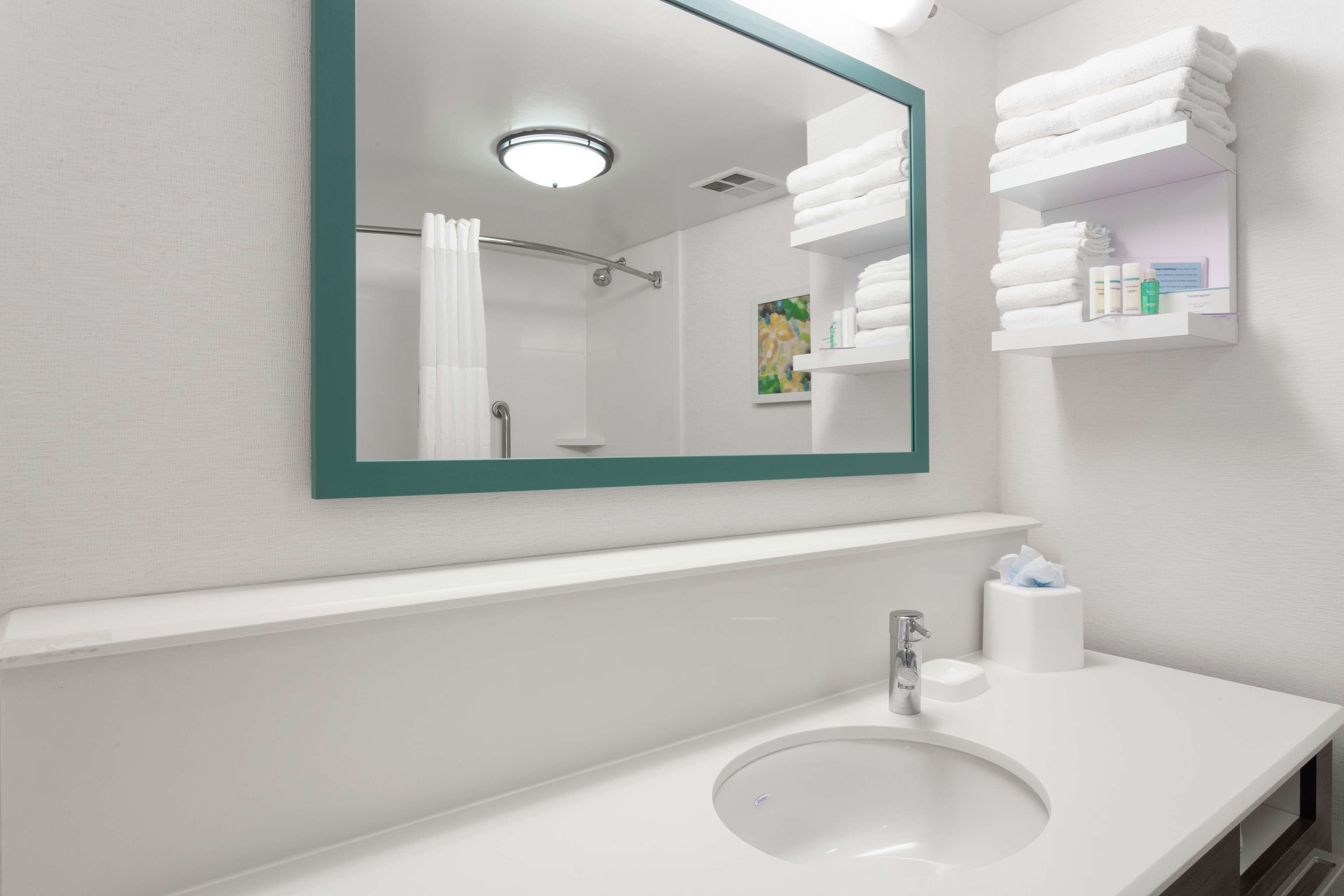 bathtub, hair dryer, towels