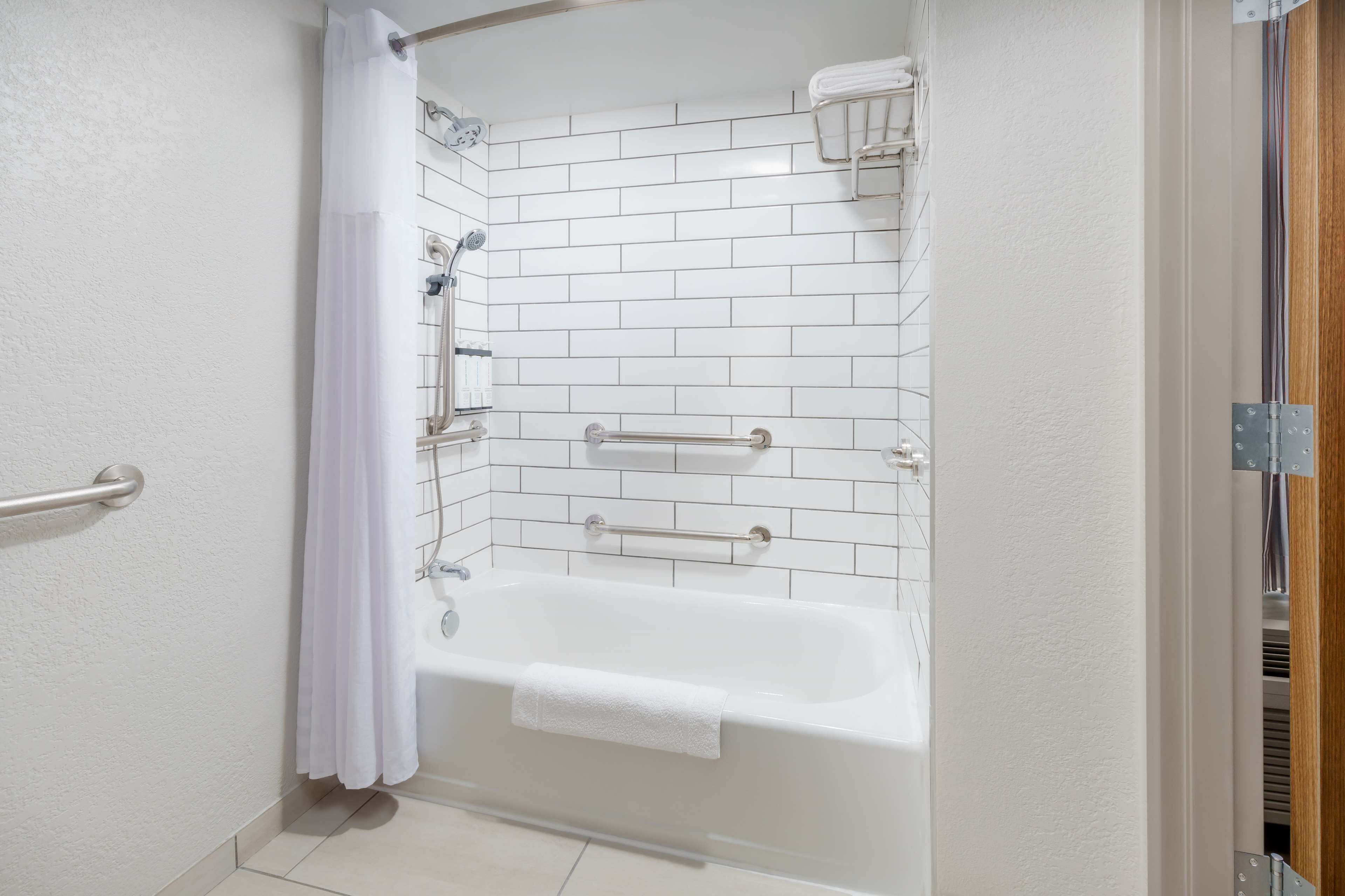 designer toiletries, hair dryer, towels