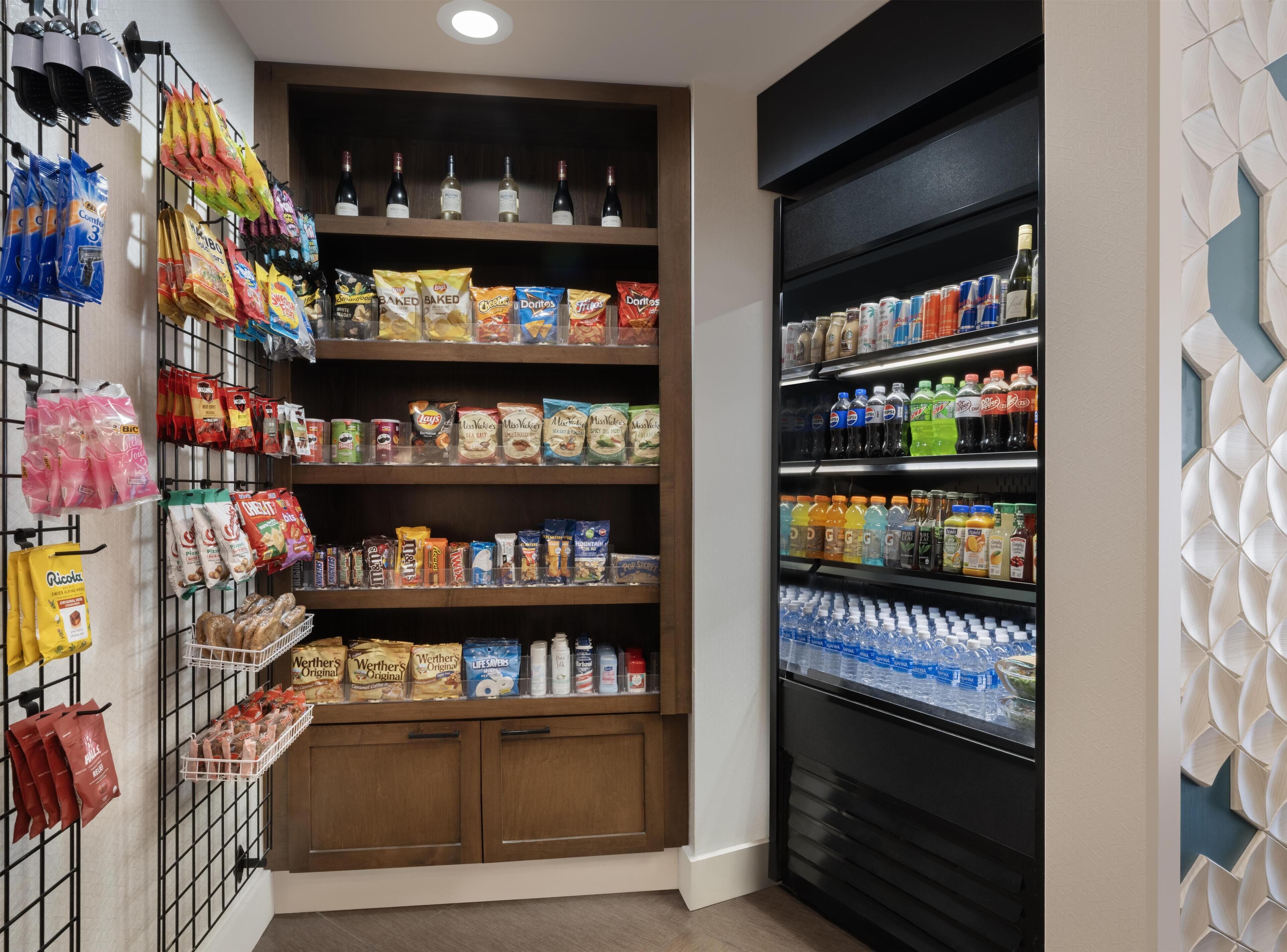A well-stocked pantry with various snacks, beverages, and condiments.