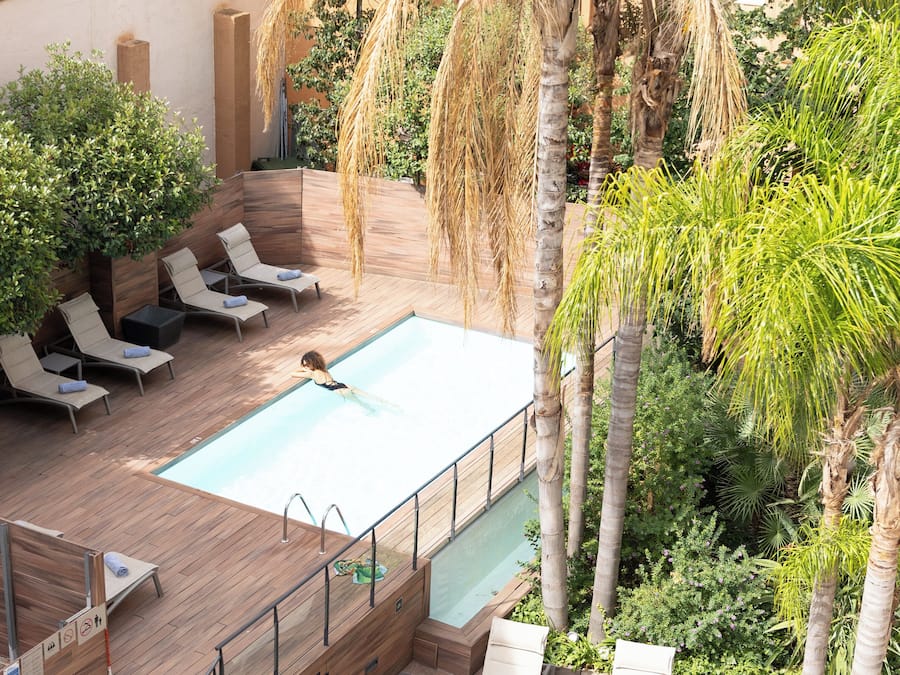 Outdoor pool, pool umbrellas, sun loungers