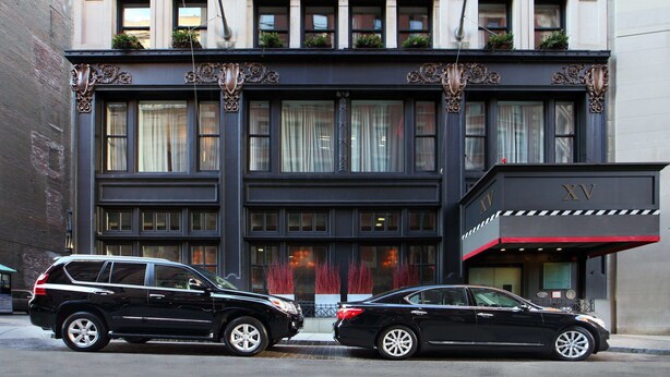 A hotel with a classic facade, large windows, and a prominent entrance. - XV Beacon (Boston)