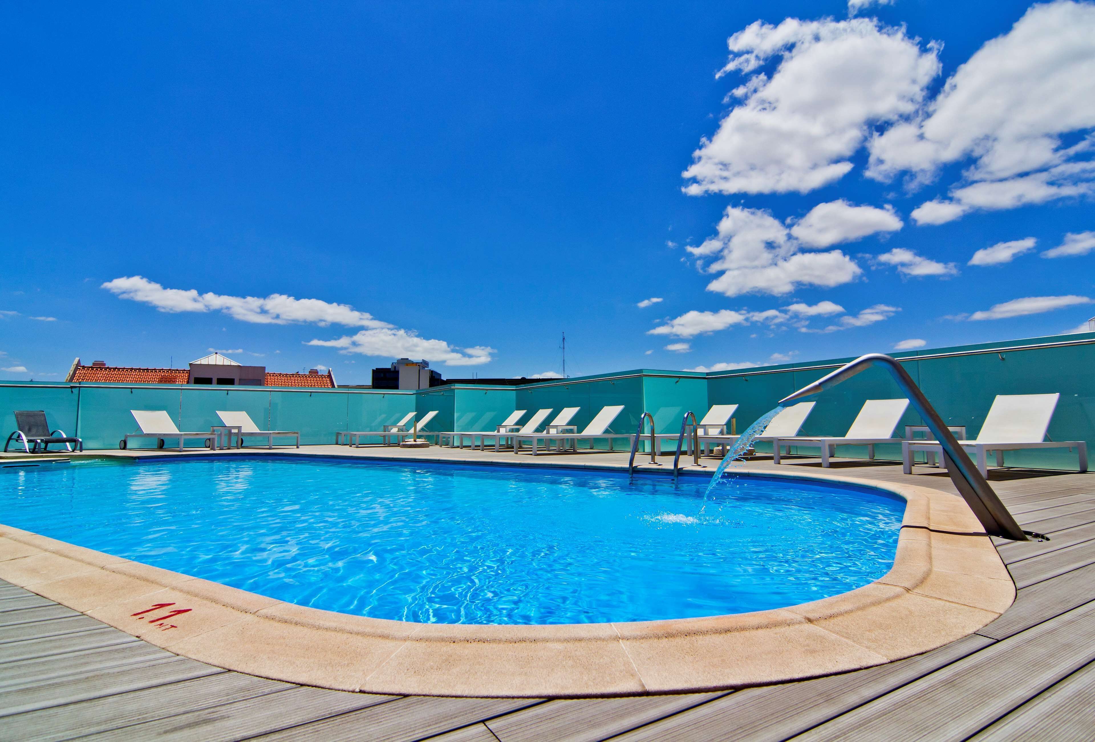 outdoor pool, pool umbrellas, pool loungers