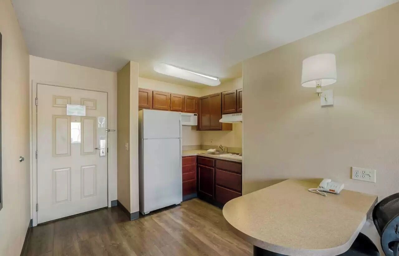 Suite, 2 Double Beds, Non Smoking | Private kitchen | Full-size fridge, microwave, stovetop, cookware/dishes/utensils