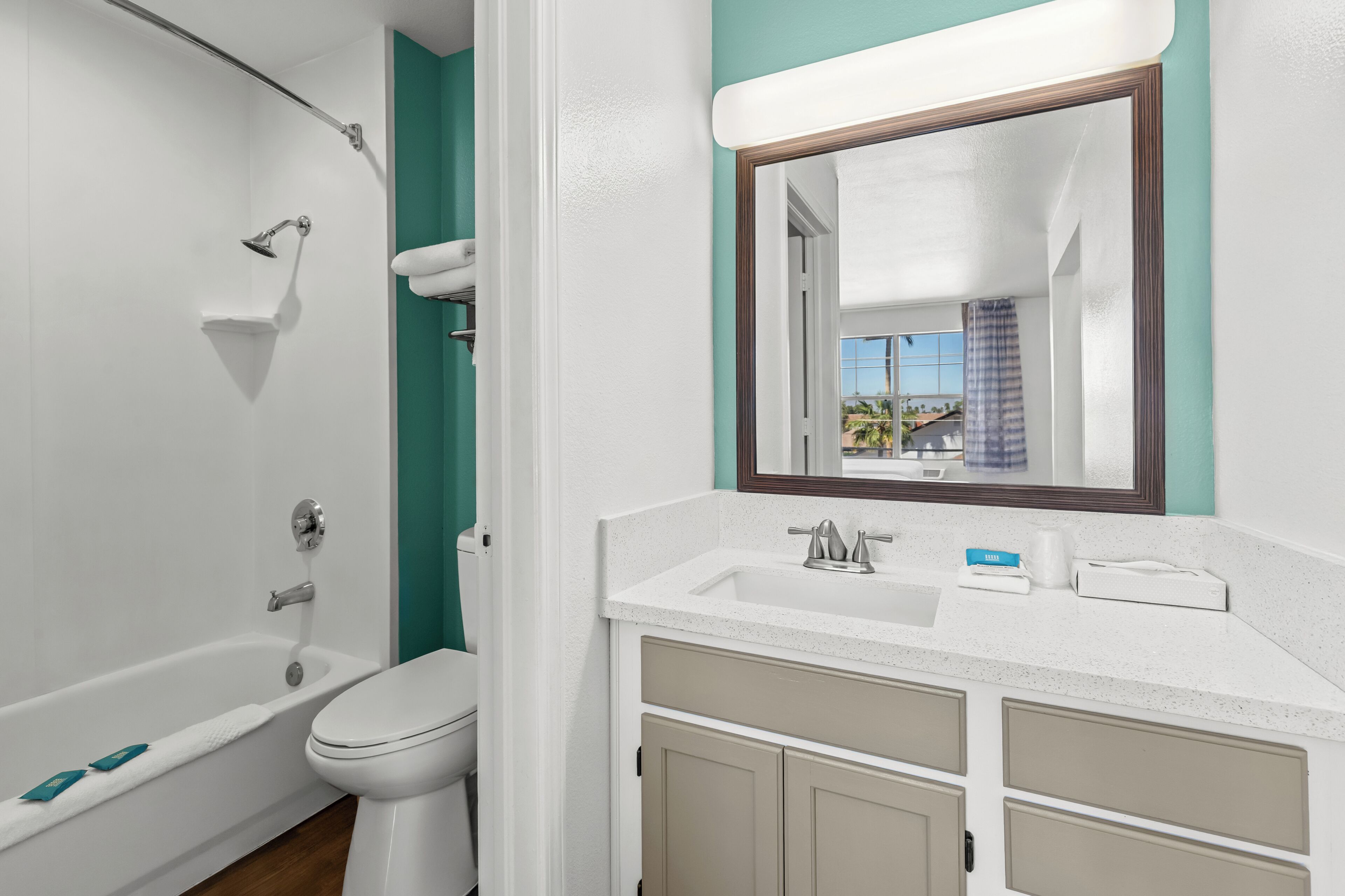Suite, 2 Double Beds, Non Smoking | Bathroom | Combined shower/tub, hair dryer, towels, soap