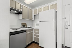 Suite, 2 Double Beds, Non Smoking | Private kitchen | Full-size fridge, microwave, stovetop, cookware/dishes/utensils
