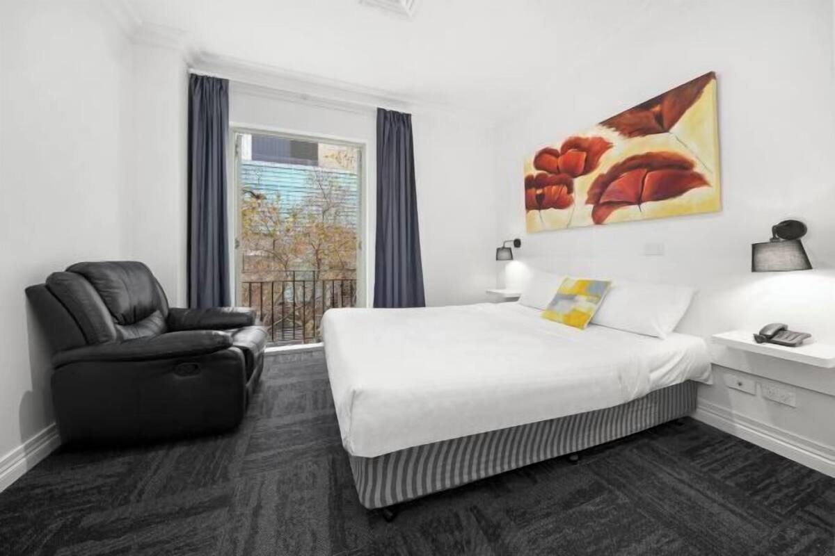 Premium bedding, blackout drapes, soundproofing, iron/ironing board