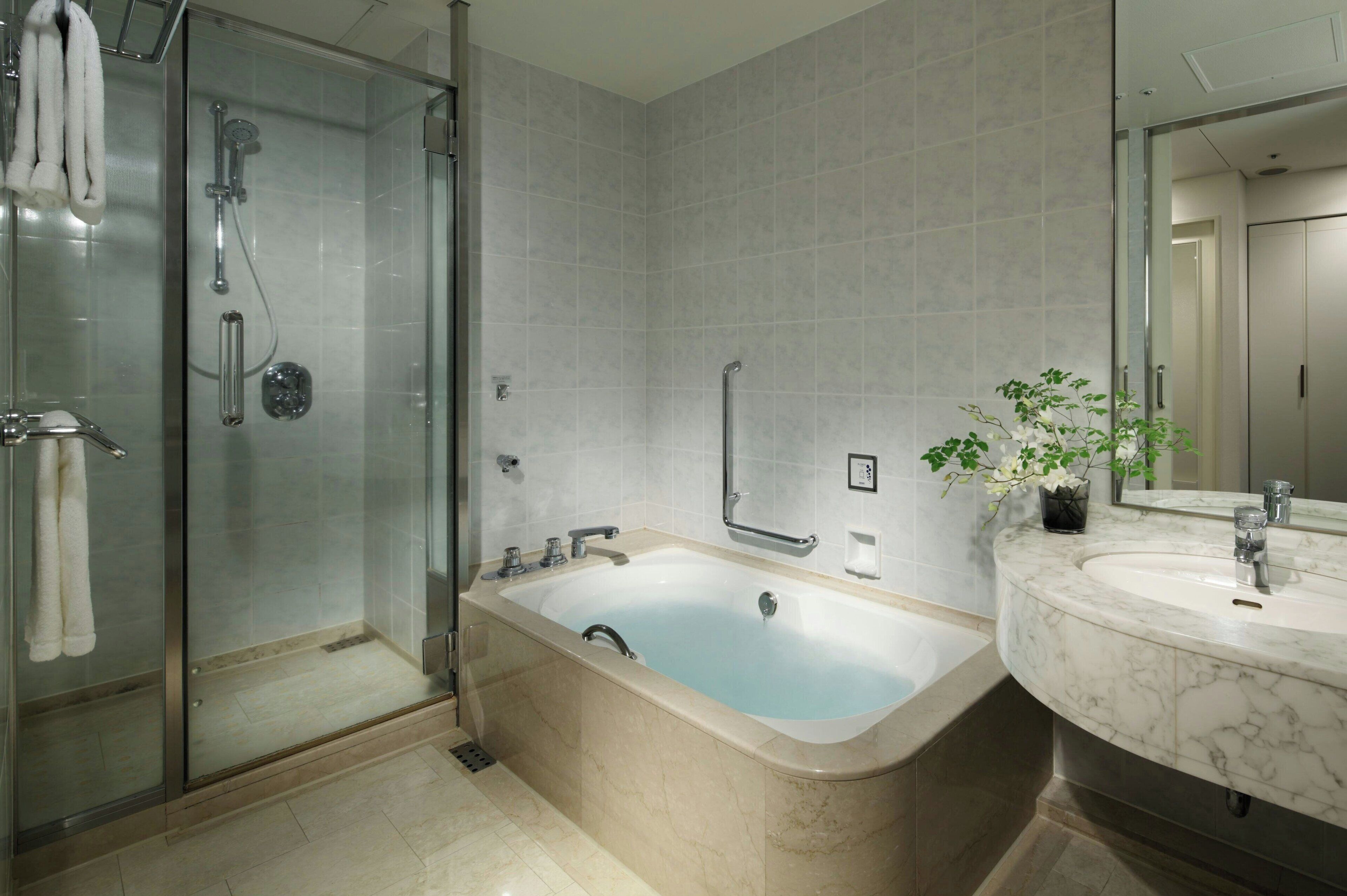 Separate tub and shower, jetted tub, free toiletries, hair dryer
