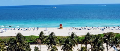 Room, 1 King Bed, Balcony, Oceanfront | Beach | On the beach, white sand, sun-loungers, beach towels
