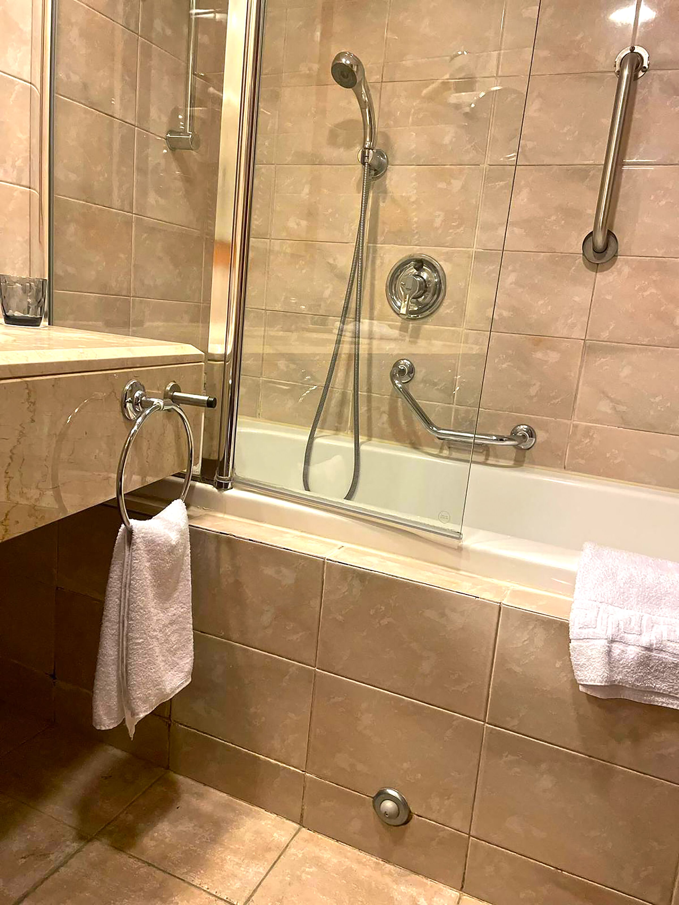 combined shower/bathtub, deep-soaking bathtub, free toiletries, towels
