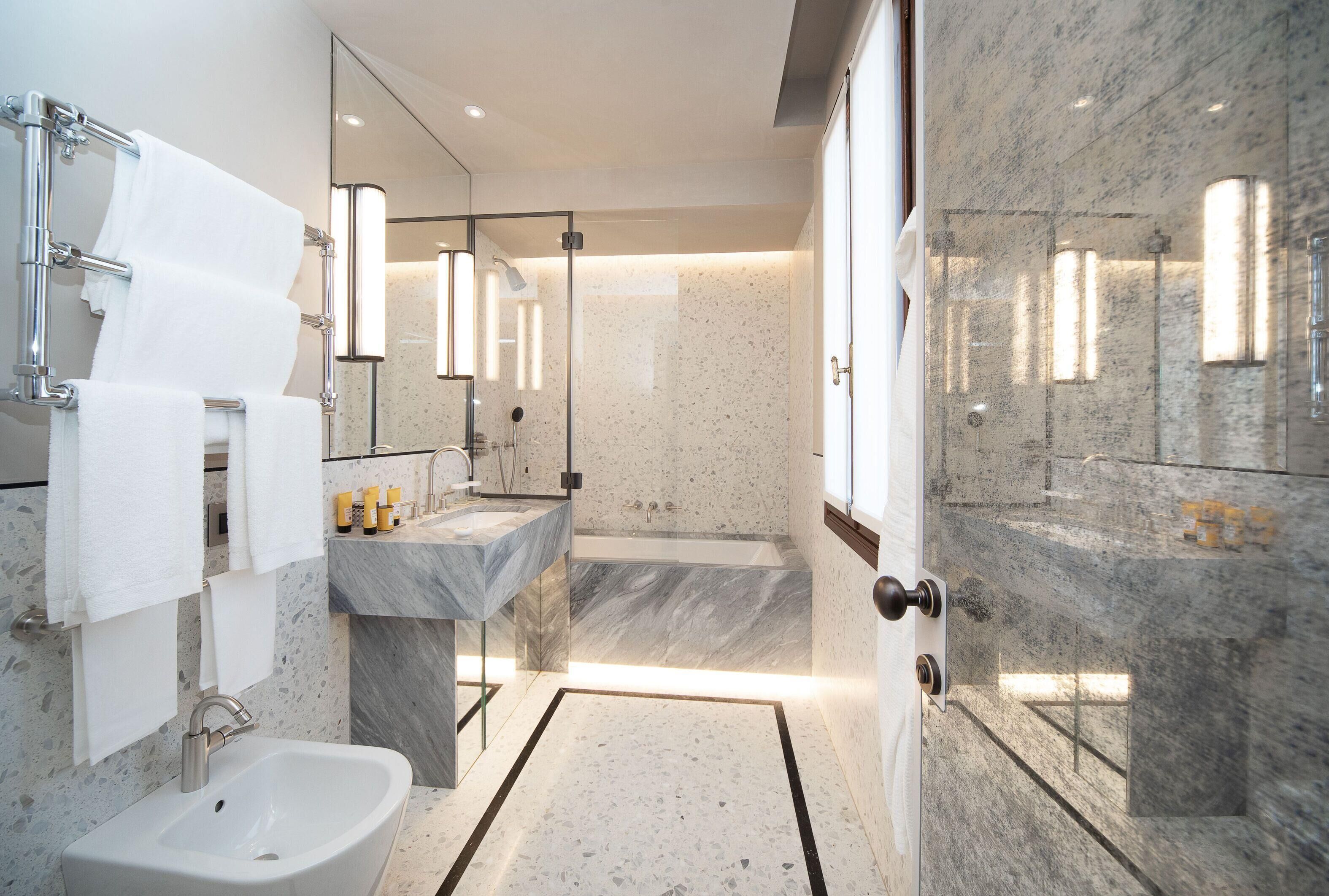 rainfall showerhead, designer toiletries, hair dryer, bathrobes