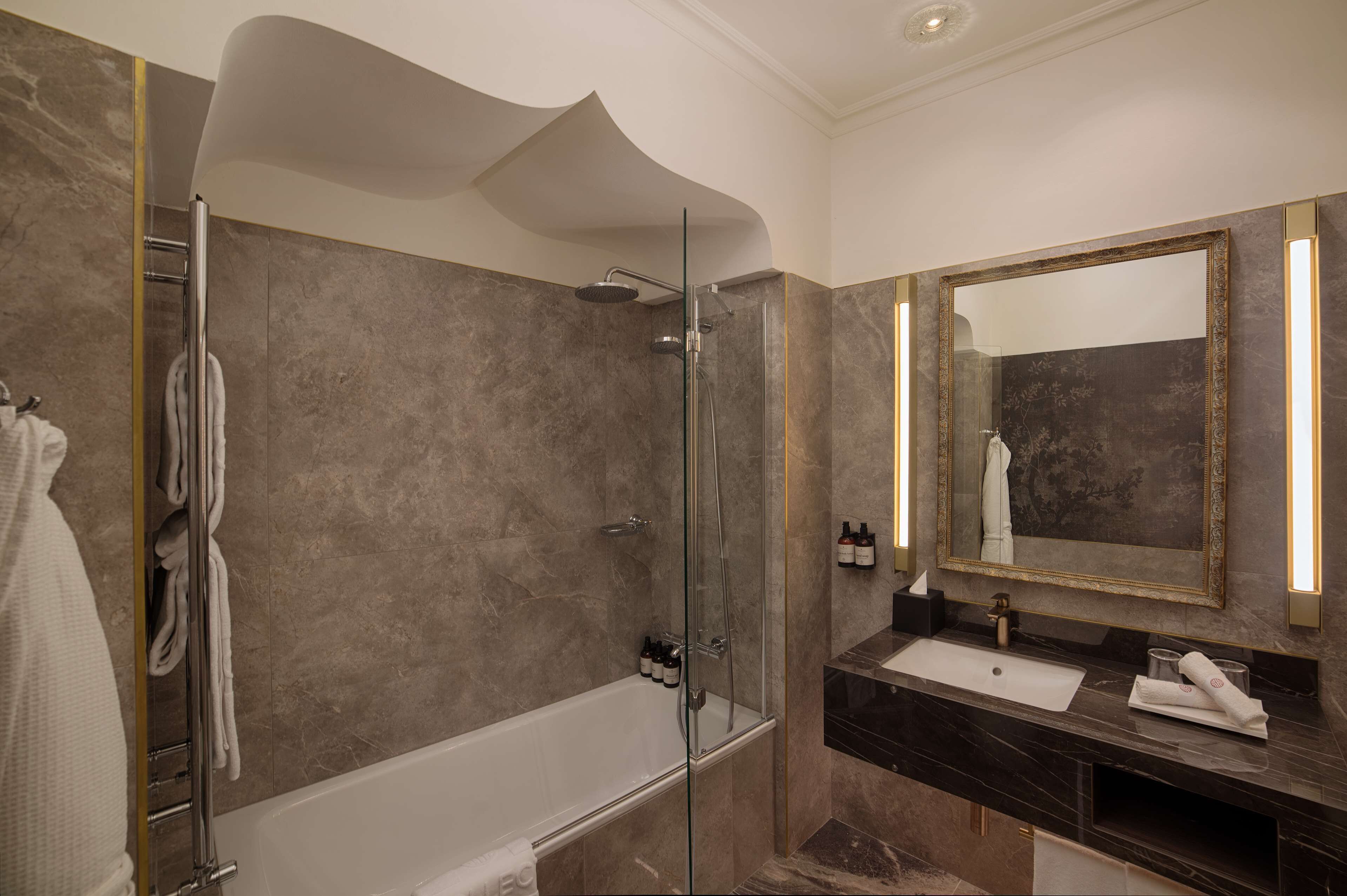 rainfall showerhead, designer toiletries, hair dryer, bathrobes