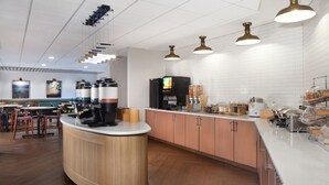 A modern kitchen area with a central island, stainless steel appliances, and pendant lighting. - Fairfield Inn & Suites by Marriott Charleston (South Charleston)