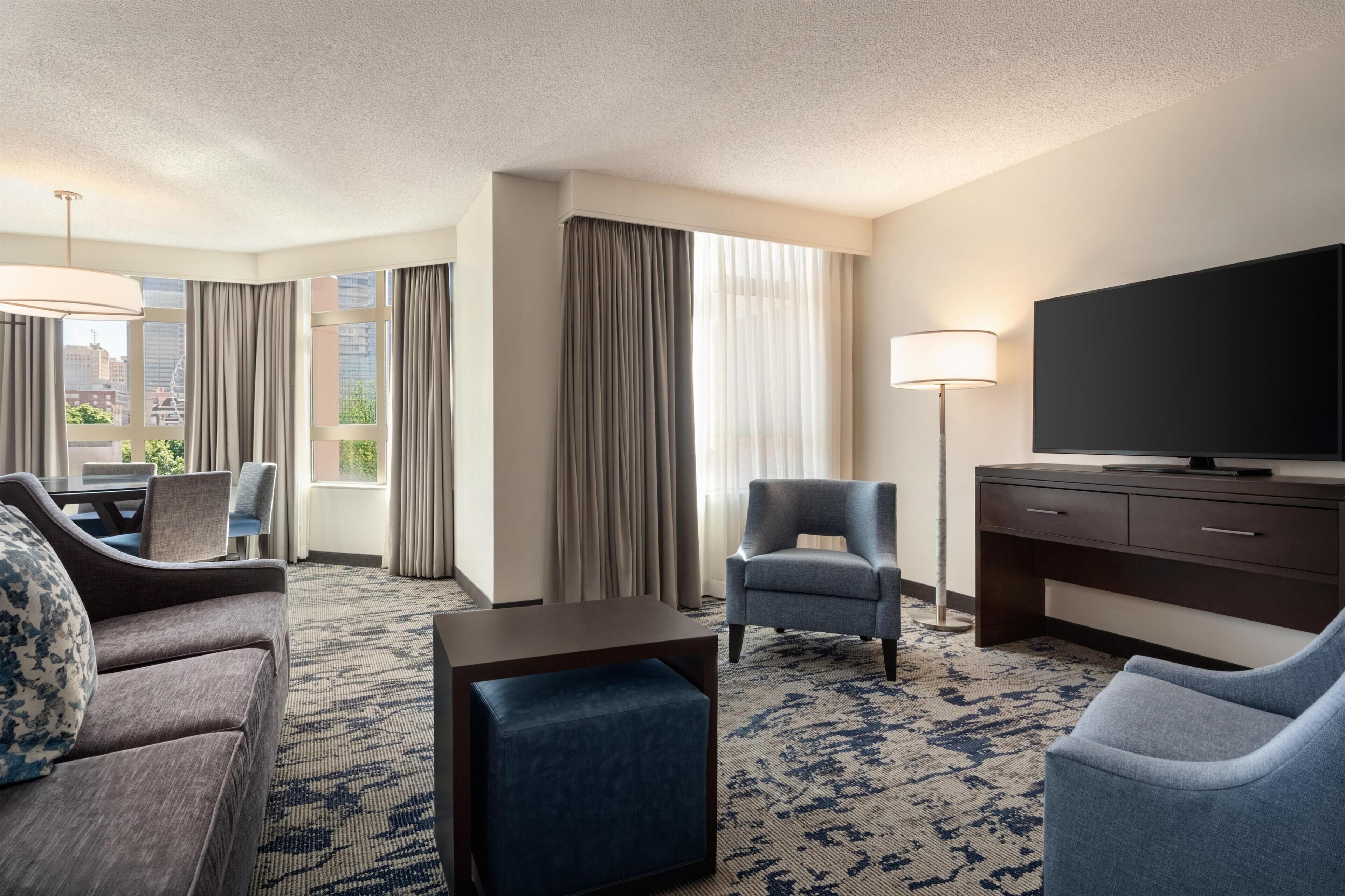 Executive Suite, 1 King Bed | Living area | 49-inch flat-screen TV with satellite channels, TV, pay films