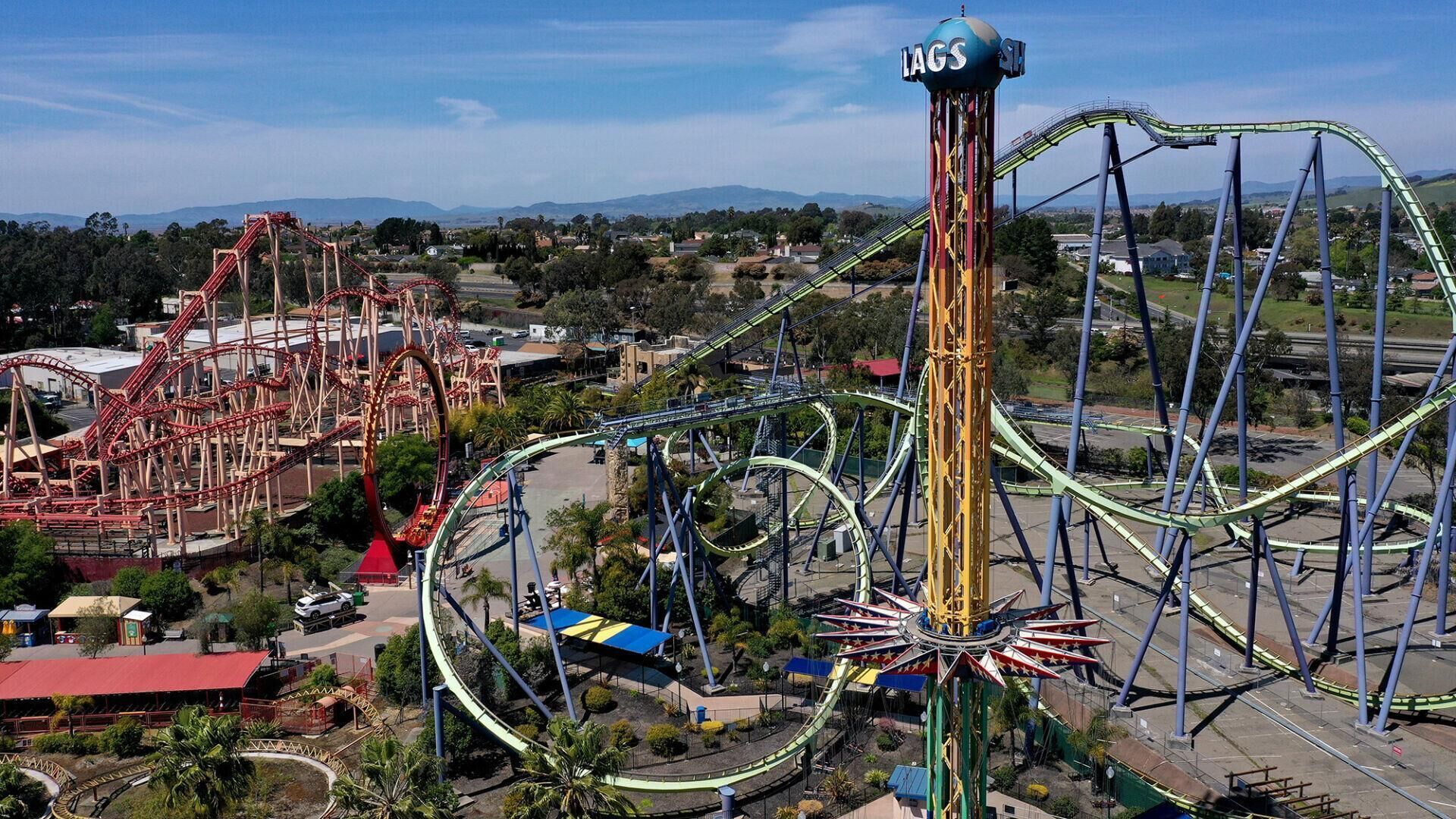 A roller coaster with multiple tracks and a tall tower structure.