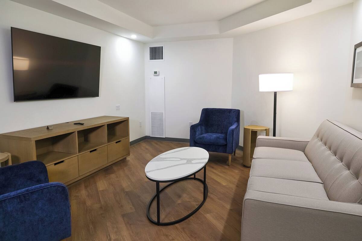 50-inch flat-screen TV with satellite channels, pay movies