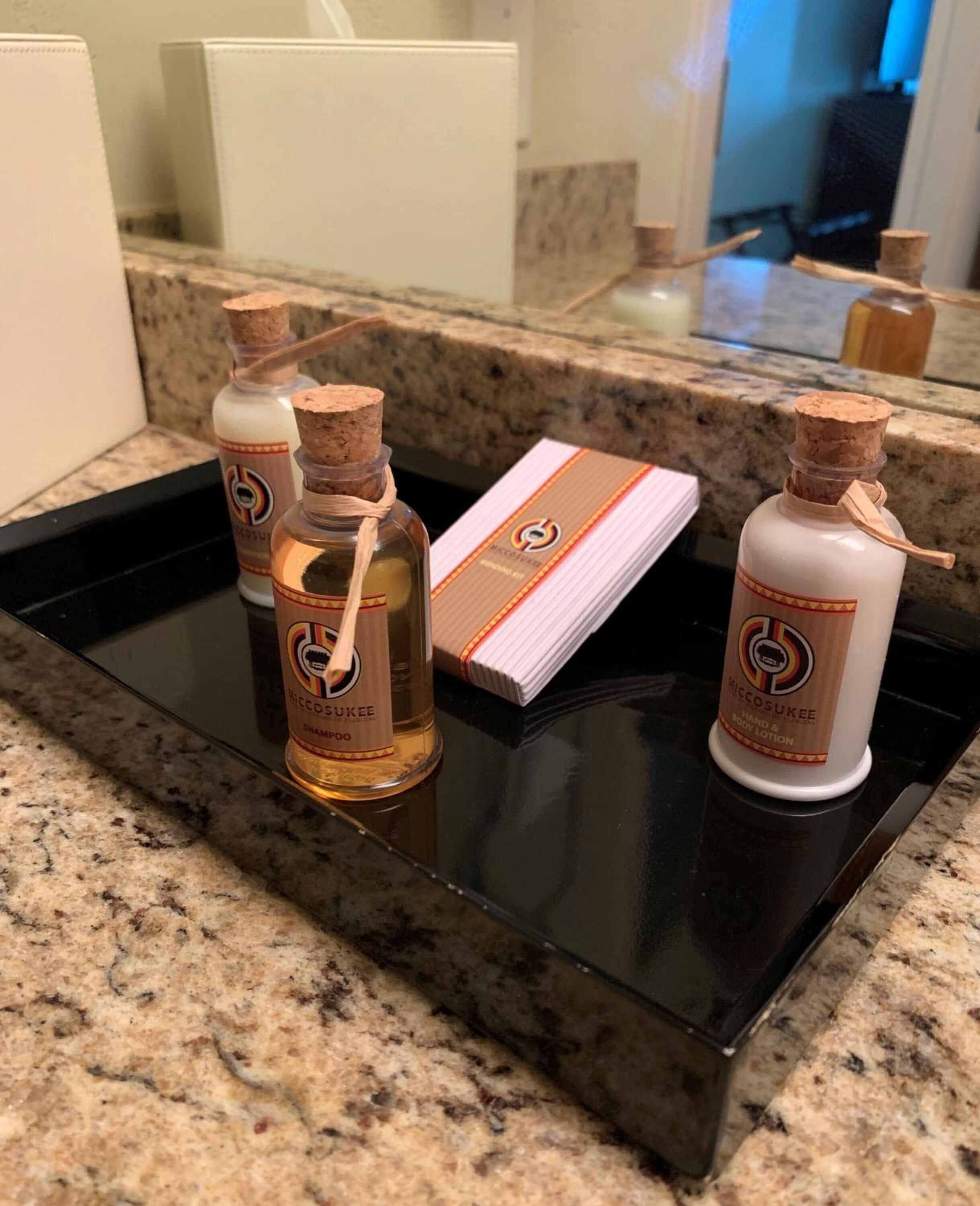 combined shower/bathtub, designer toiletries, hair dryer, towels