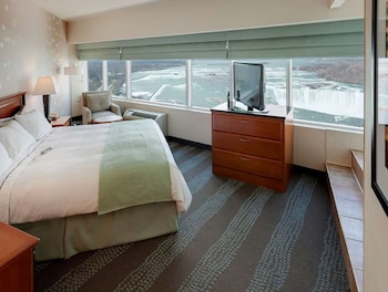 Room, 1 King Bed, Jetted Tub, View (Non-smoking) | Desk, blackout drapes, iron/ironing board, free cribs/infant beds at Radisson Hotel & Suites Fallsview, ON