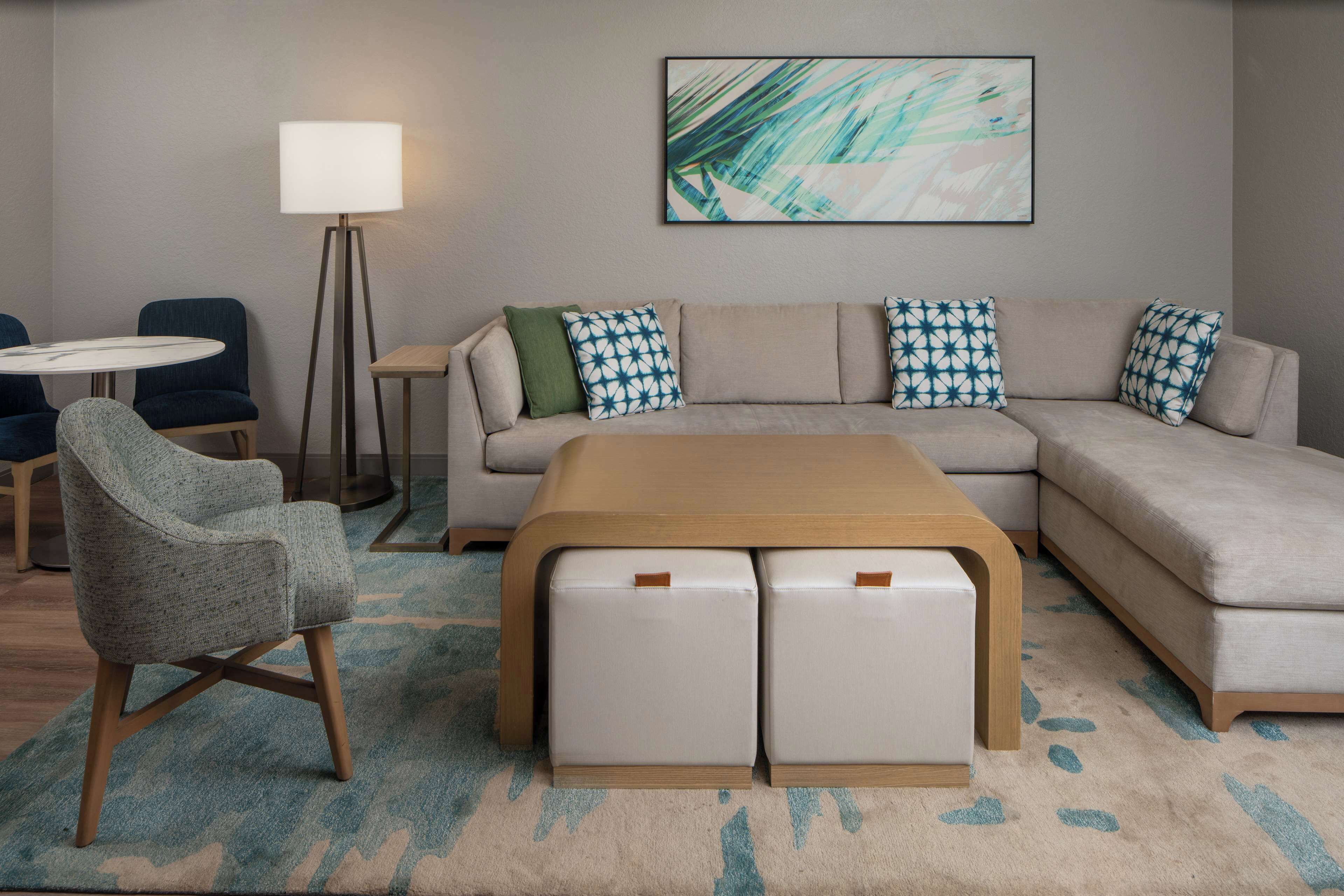 one bedroom suite, one king bed | living area | flat-screen tv, pay films