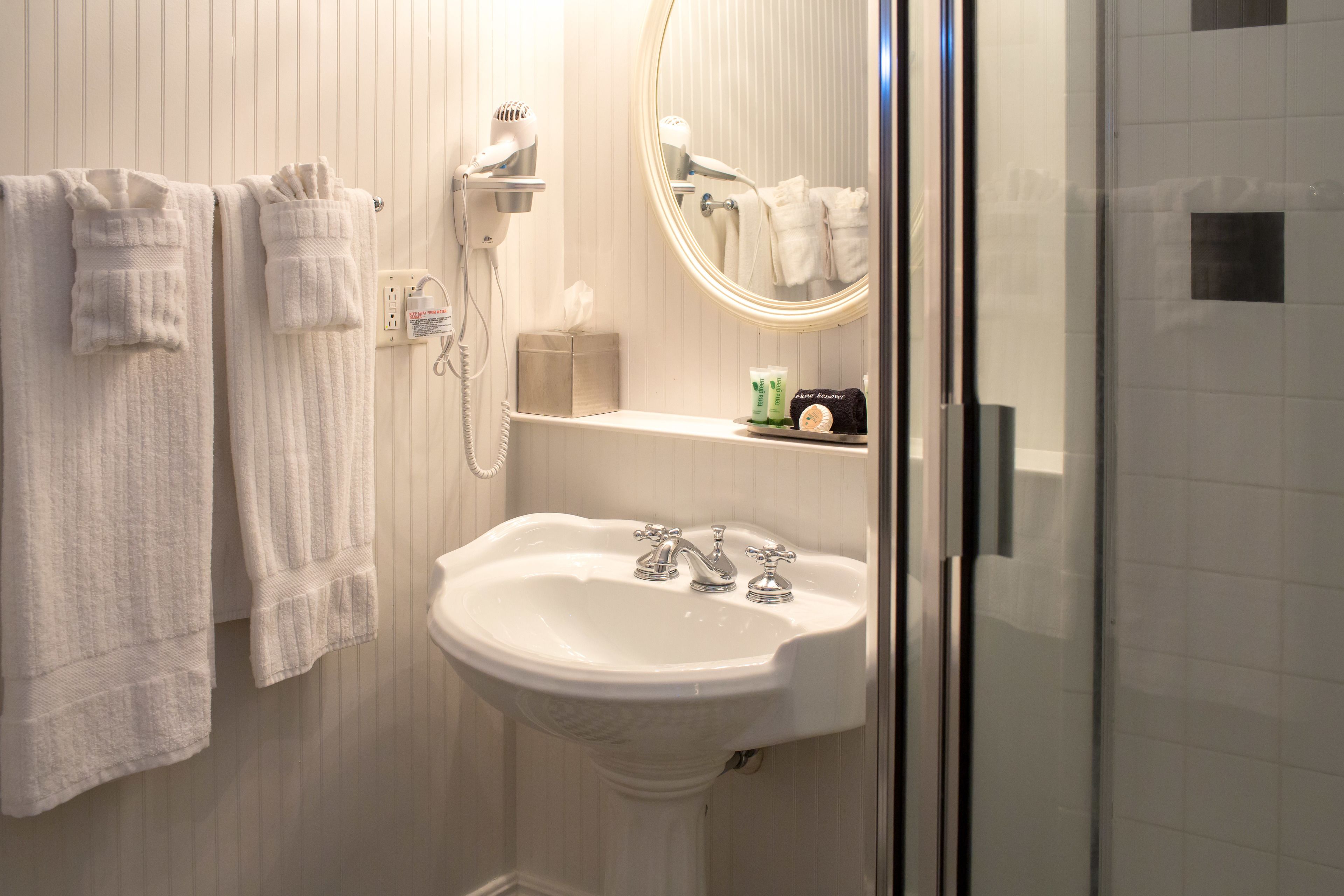 designer toiletries, hair dryer, bathrobes, towels