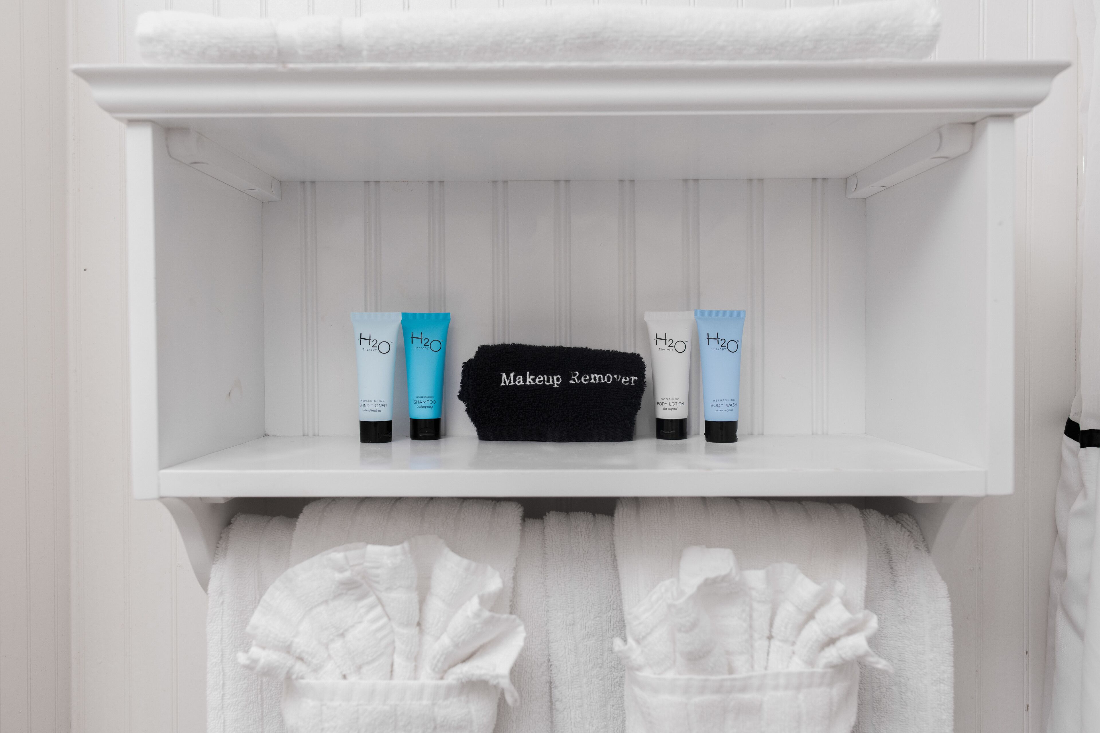 designer toiletries, hair dryer, bathrobes, towels