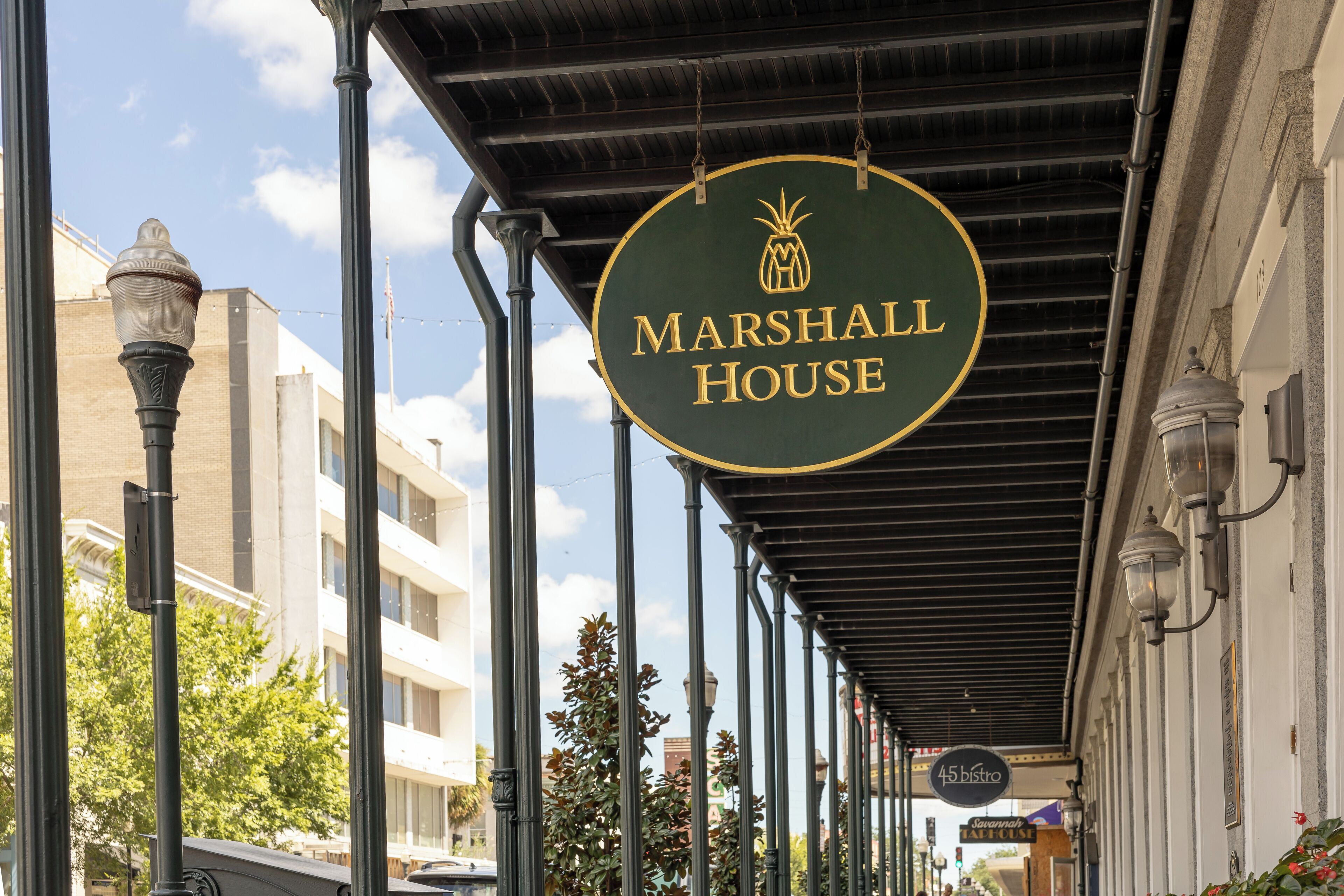 A building with a sign reading "MARSHALL HOUSE" and another sign for "45 Bistro".