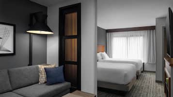A hotel room with a sofa, two beds, a TV, and a large window with curtains.