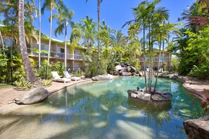 Outdoor pool, pool loungers -  Hotel Tropiq (Cairns North)